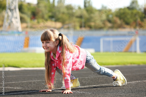 Little girl in ready positi...