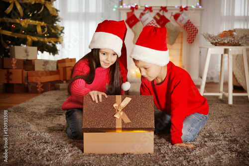 Cute little kids in Santa h...