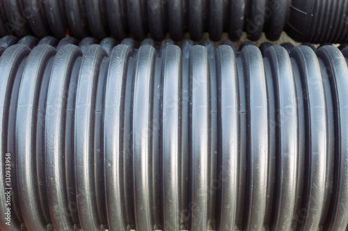 Fotografie Close up view of garnered black plastic substructure pipes