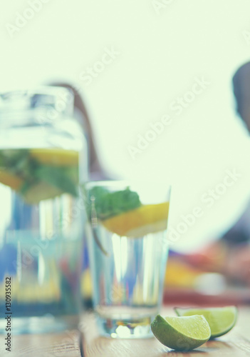 Glass with drink lime on desk