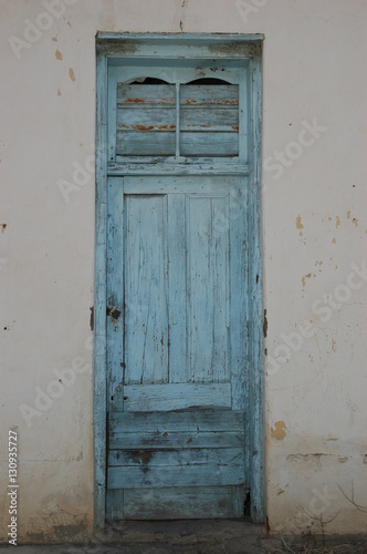 Antique door with peeling paint © Anthony