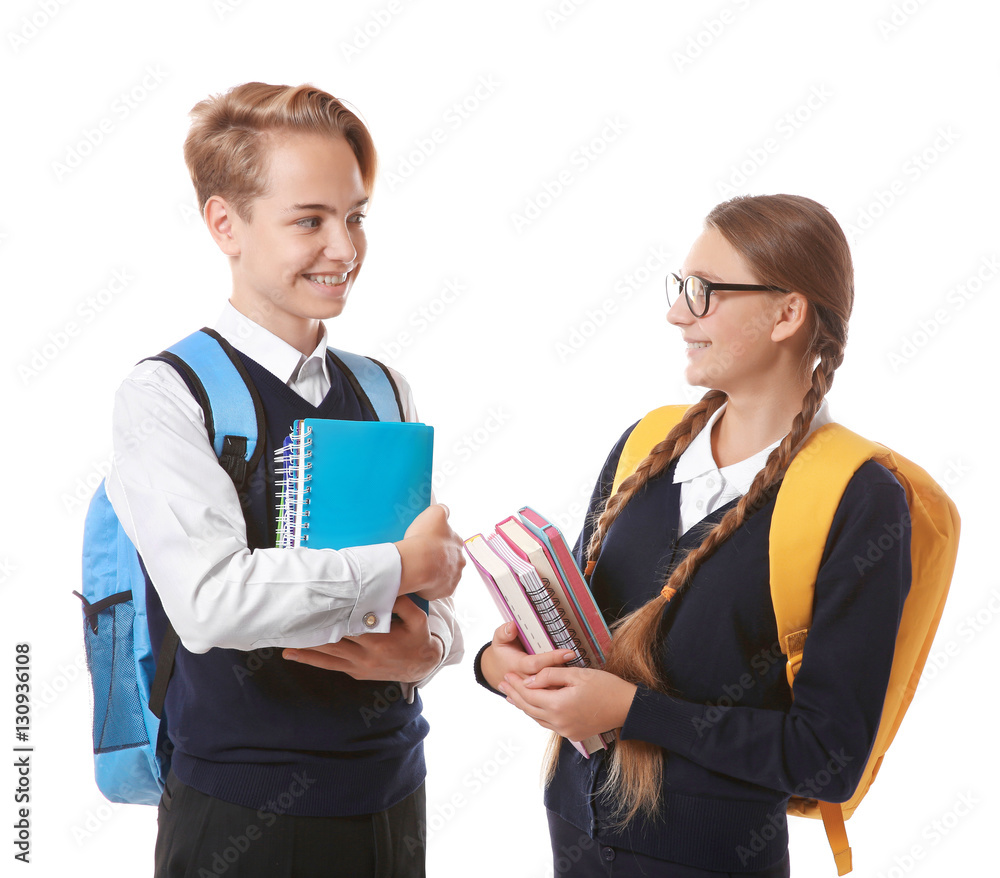 Teenagers with backpacks holding books on white background Teenagers with backpacks holding books on white background