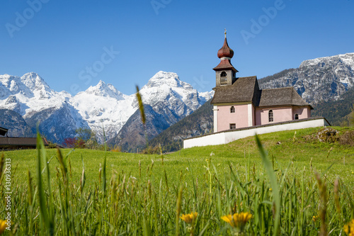 Alpine landscape with chapel and snow-capped mountains at Lofer, Austria