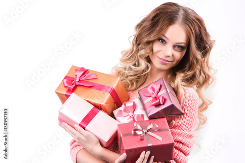 Cheerful girl with gift boxes.