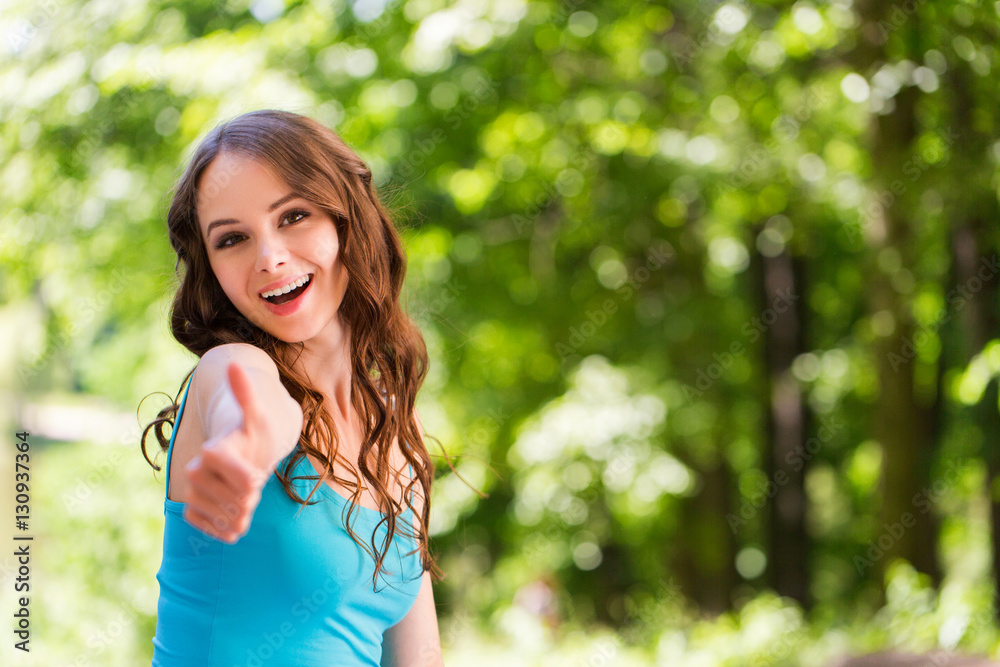 Beautiful sport girl looking at the camera and thumbs up. Beautiful sport girl looking at the camera and thumbs up.