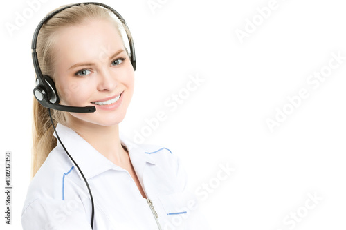 Portrait of a beautiful medical secretary with handset at hospital.