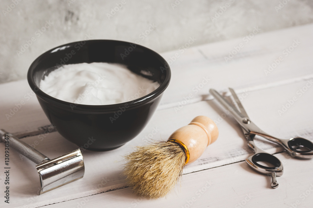 Mens hairdressing wooden desktop with tools for shaving Mens hairdressing wooden desktop with tools for shaving