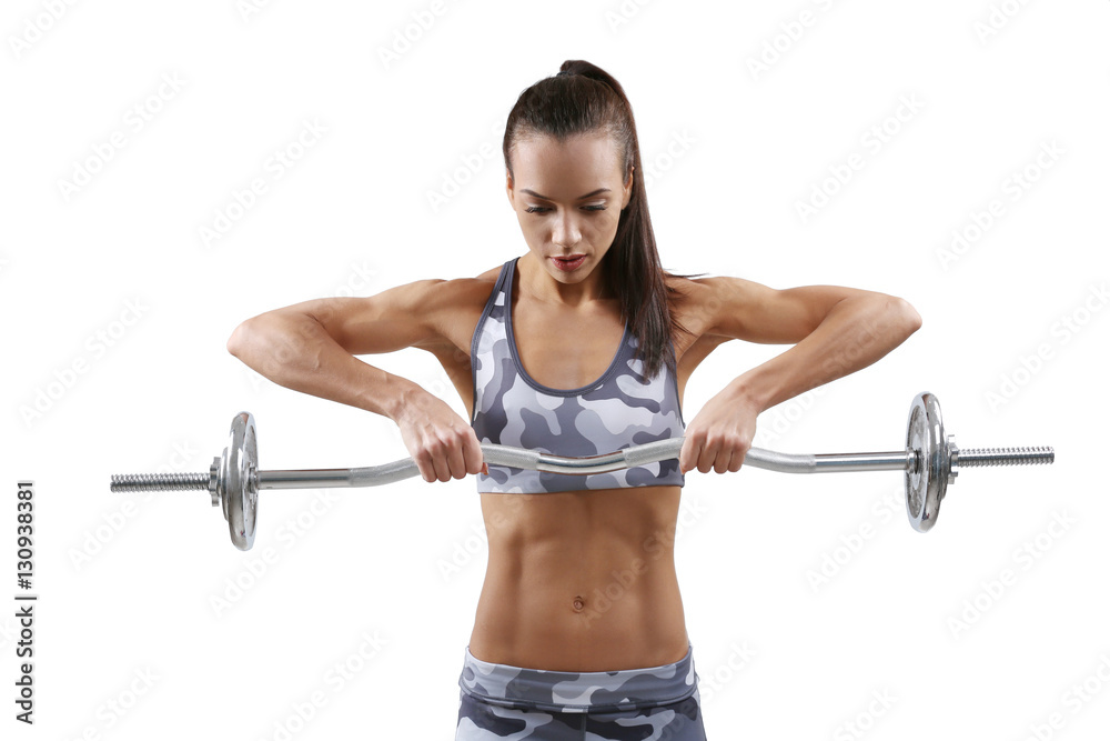 Obraz premium Sporty young woman with barbell on gray background