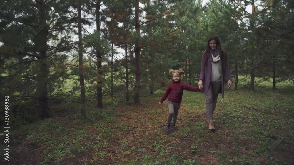 Mother and daughter walking in the autumn forest 4K Mother and daughter walking in the autumn forest 4K