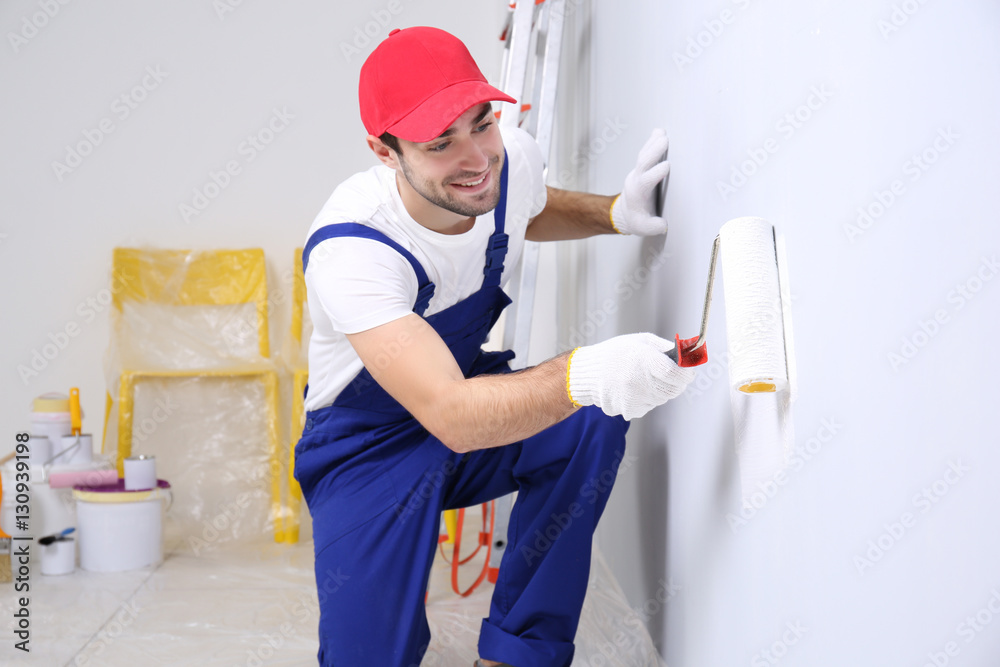 Work in paints. Work in paints. Маляр. Painting work. Маляр красит стену.