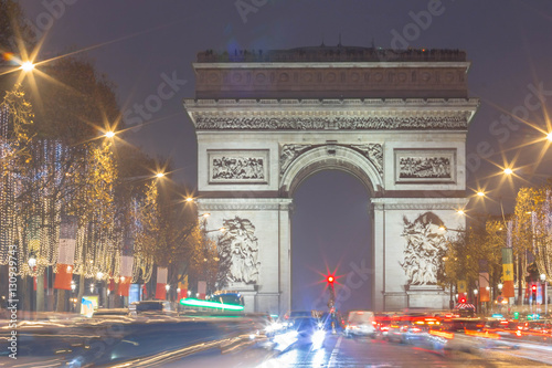 The Triumphal Arch and Champs Elysees avenue decorated for Christmas, Paris, France. © kovalenkovpetr