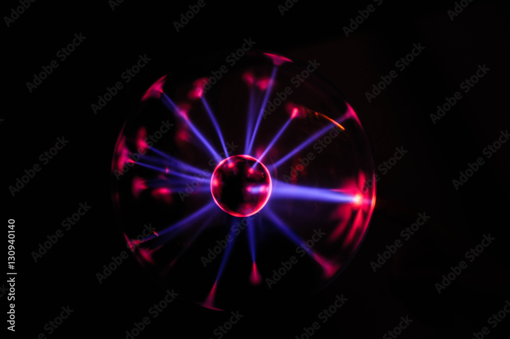 Plasma ball lamp energy, hand touching glowing glass sphere concept for power, electricity, science and physics Plasma ball lamp energy, hand touching glowing glass sphere concept for power, electricity, science and physics