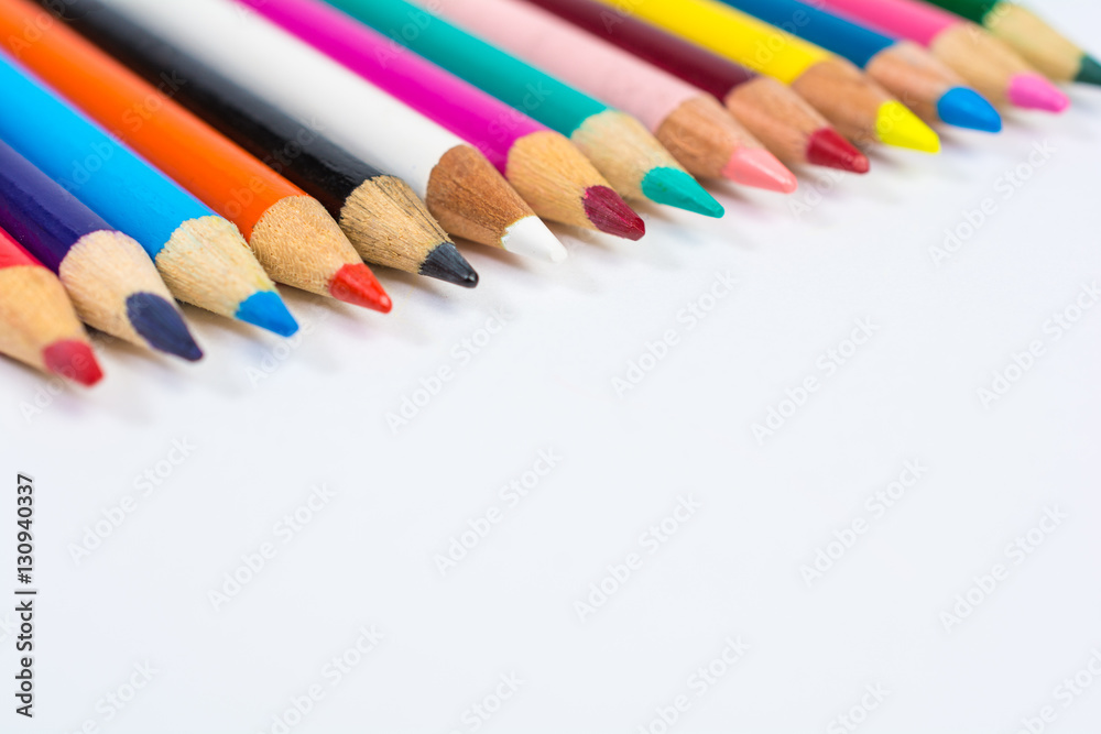 Line of Colored Pencil Crayons Close Up Isolated on White Line of Colored Pencil Crayons Close Up Isolated on White