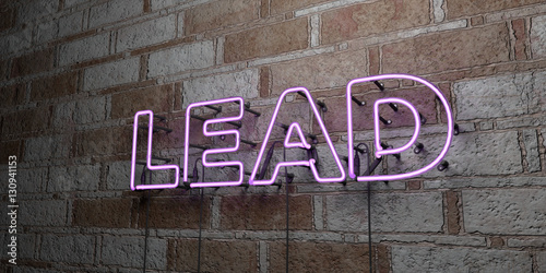 LEAD - Glowing Neon Sign on stonework wall - 3D rendered royalty free stock illustration.  Can be used for online banner ads and direct mailers.. photo
