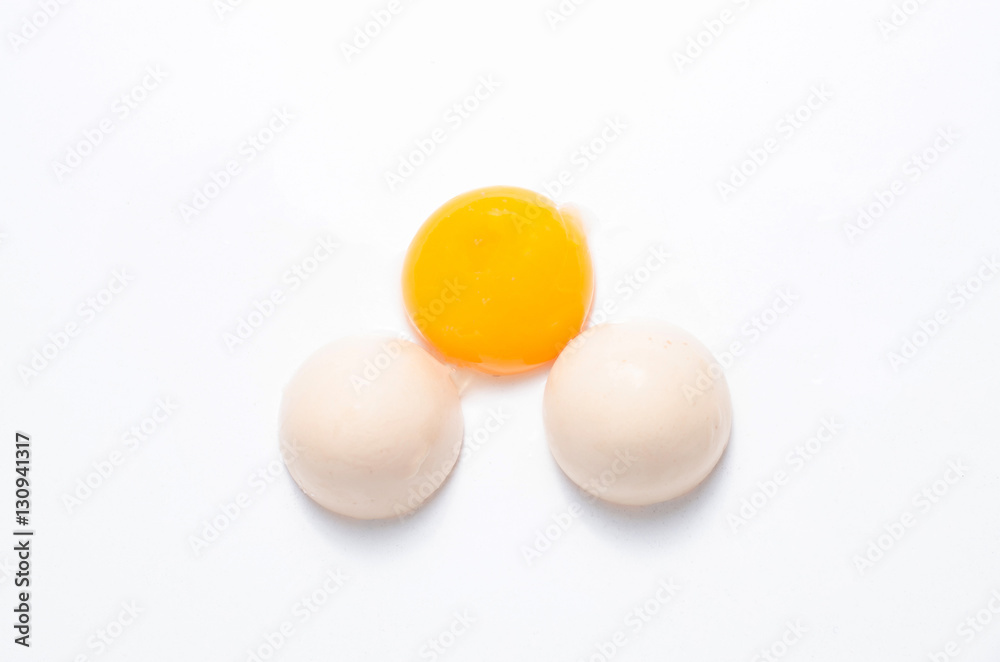 Eggs chicken bird with egg yolk and shell on a gray background Eggs chicken bird with egg yolk and shell on a gray background