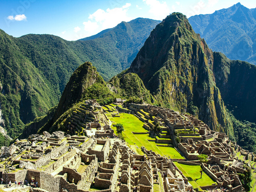 Machu Picchu, peruvian lost city of Incas situated on mountain ridge above Sacred Valley of Urubamba River in Cusco Region, Peru. UNESCO World Heritage and one of the New Seven Wonders of the World photo
