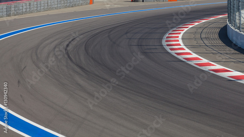 Obraz na plátne Motor racing track. Turning asphalt road with marking lines