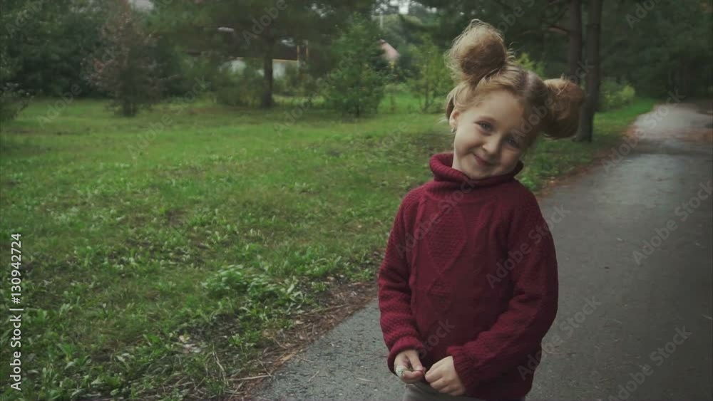 Portrait of little cute smiling girl in the autumn park. HD Portrait of little cute smiling girl in the autumn park. HD