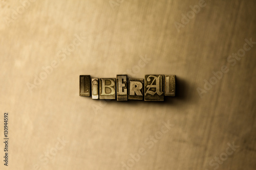 LIBERAL - close-up of grungy vintage typeset word on metal backdrop. Royalty free stock - 3D rendered stock image.  Can be used for online banner ads and direct mail. photo