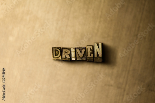 DRIVEN - close-up of grungy vintage typeset word on metal backdrop. Royalty free stock - 3D rendered stock image. Can be used for online banner ads and direct mail.
