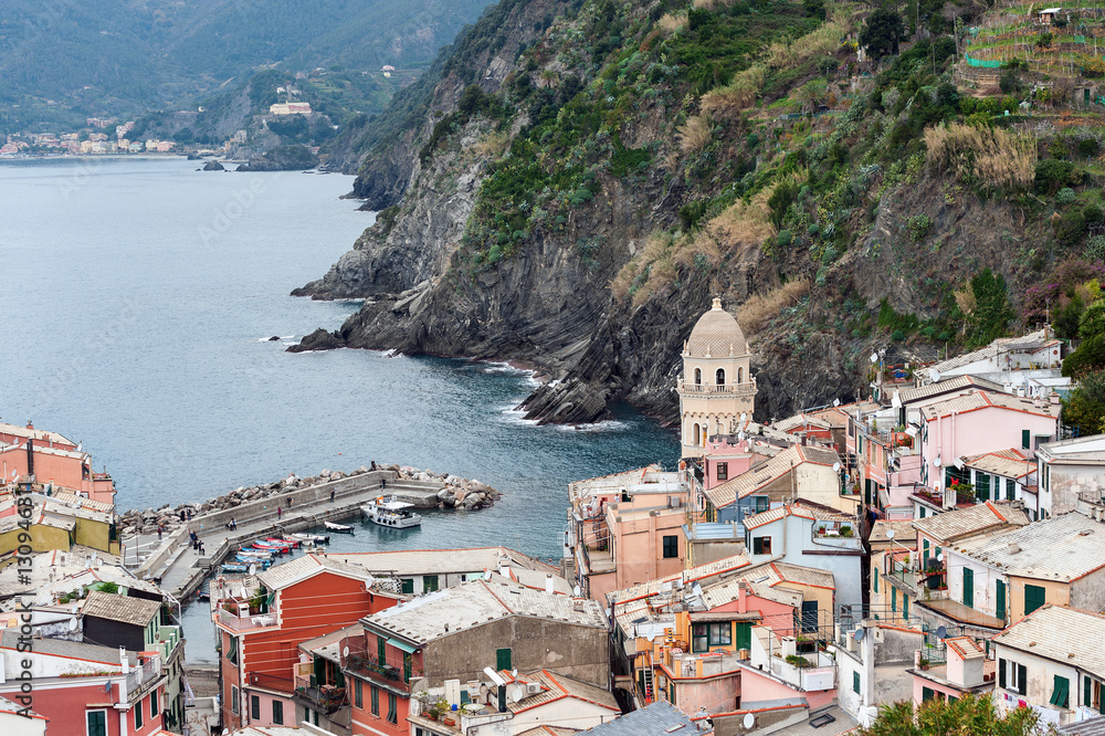 View from high hill on Vernazza houses and blue sea, Cinque Terre national park, Liguria, Italy