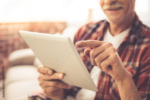 Mature man with gadget