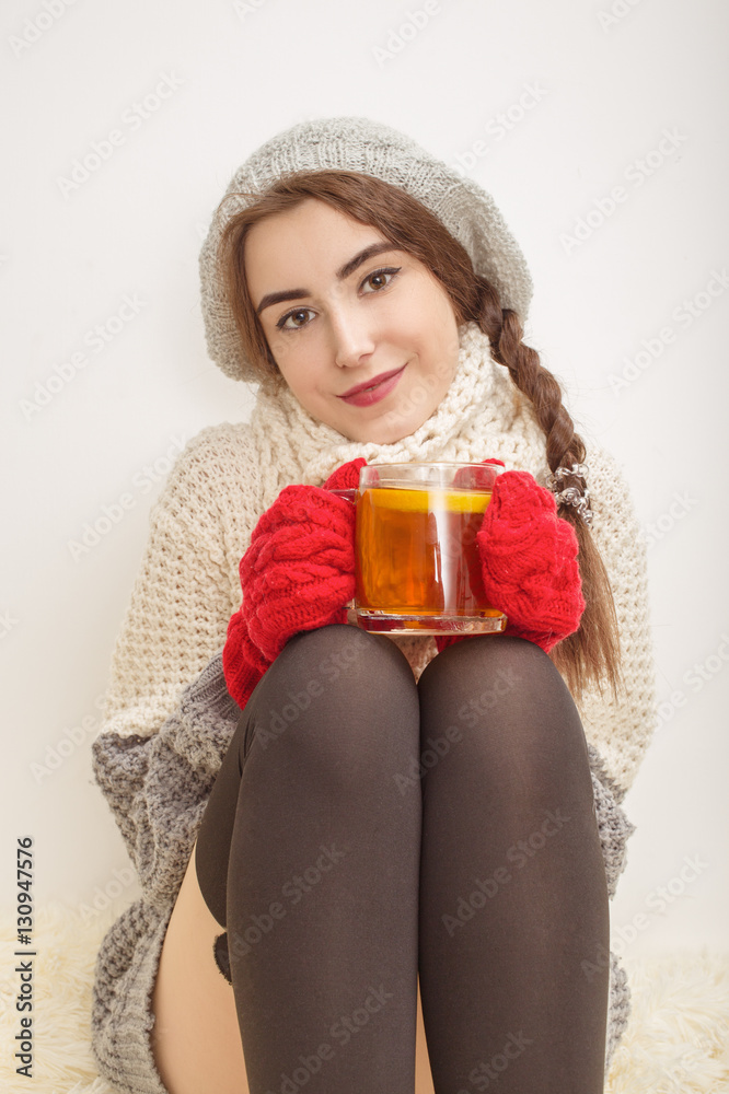 happy girl in winter clothes with cup of tea happy girl in winter clothes with cup of tea