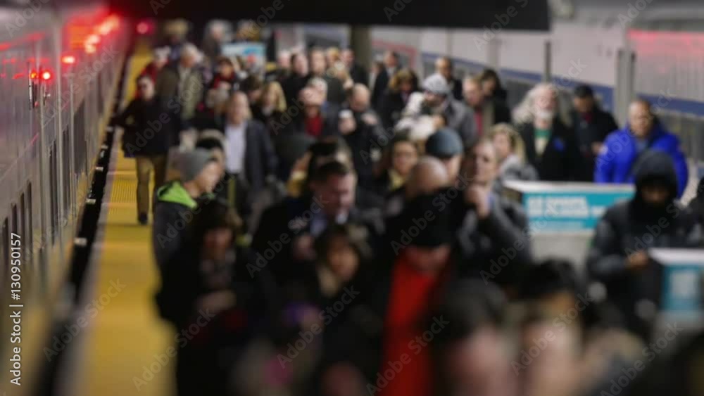 NEW YORK - Circa December, 2016 - An extreme slow motion shot of commuters exiting a train inside Grand Central Station.  	