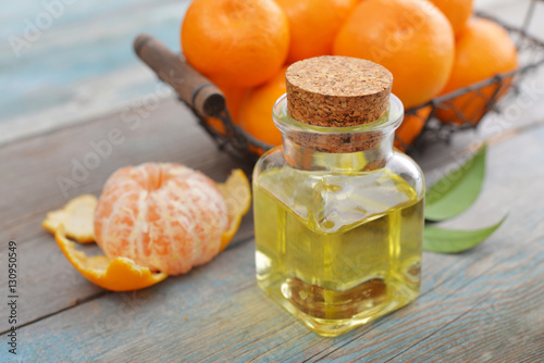 Tangerine essential oil in a glass bottle