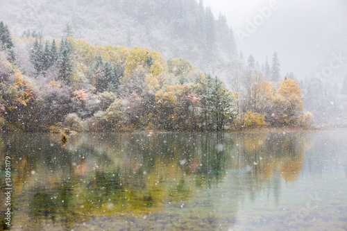 First snow in Autumn at jiuzhaigou lake, china