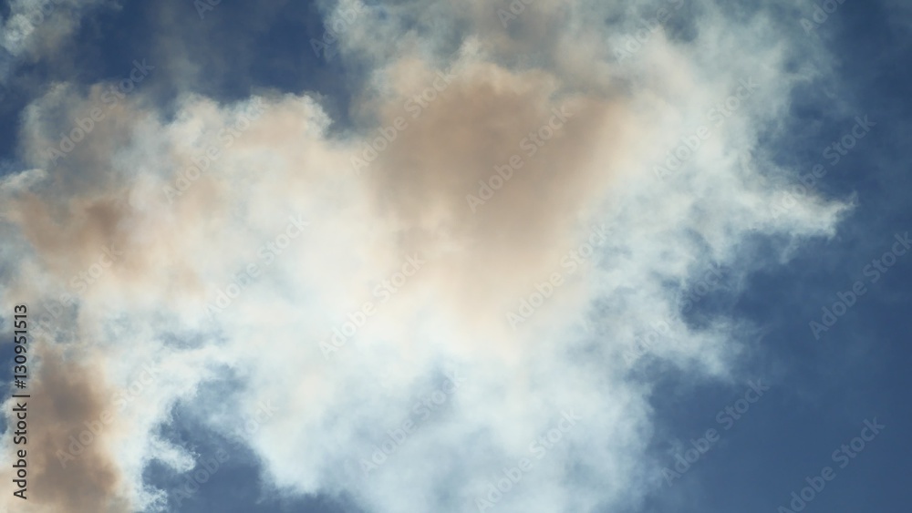 white smoke against a blue cloud sky sunlight landscape nature