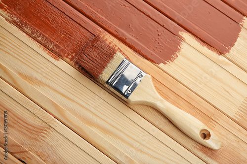 Painting brush on wooden background