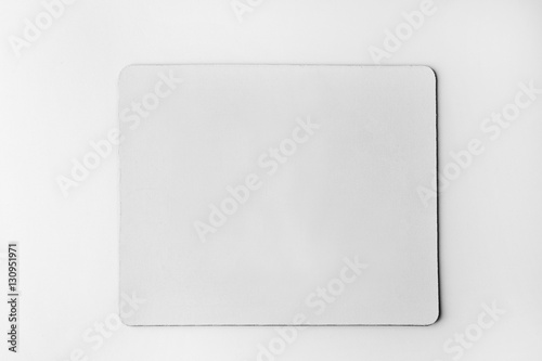 Blank mouse mat on white background photo