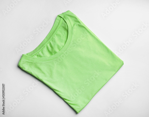 Blank light green t-shirt on white background
