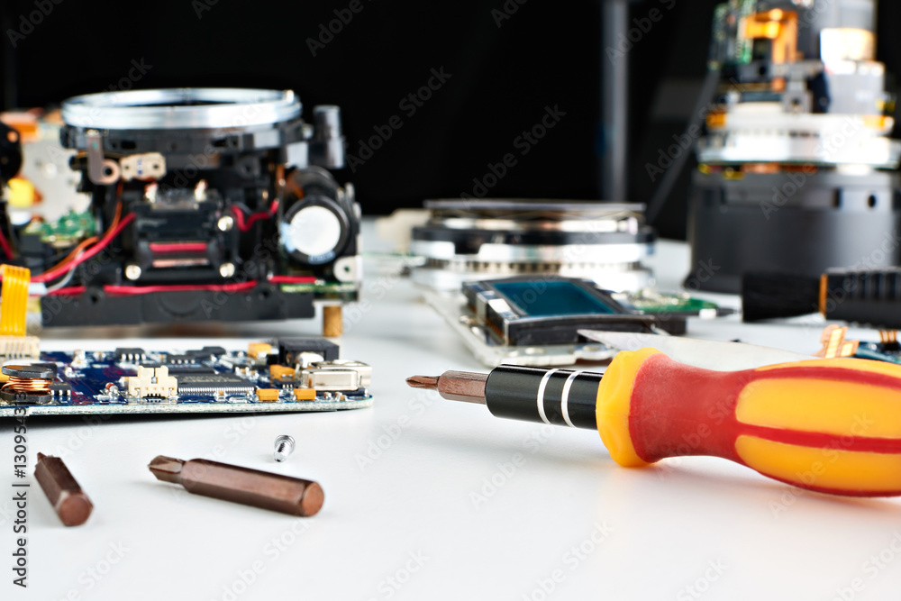 Screwdriver in workplace service engineer to repair cameras