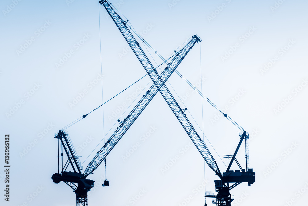 Low Angle View Of Cranes against skyline in Shanghai,China. Low Angle View Of Cranes against skyline in Shanghai,China.