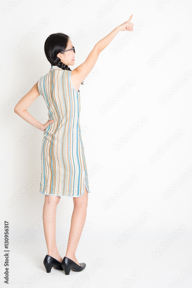 Asian girl pointing away Asian girl pointing away