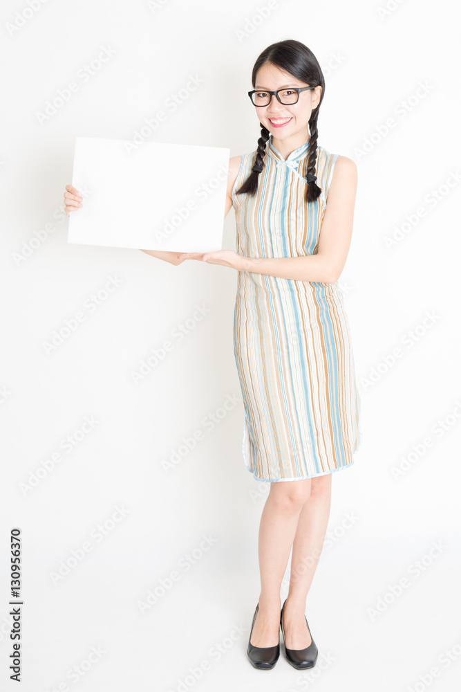 Asian female holding white blank paper card Asian female holding white blank paper card