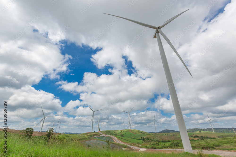 Huge wind turbine under clouds and blue sky, Huge wind turbine under clouds and blue sky,