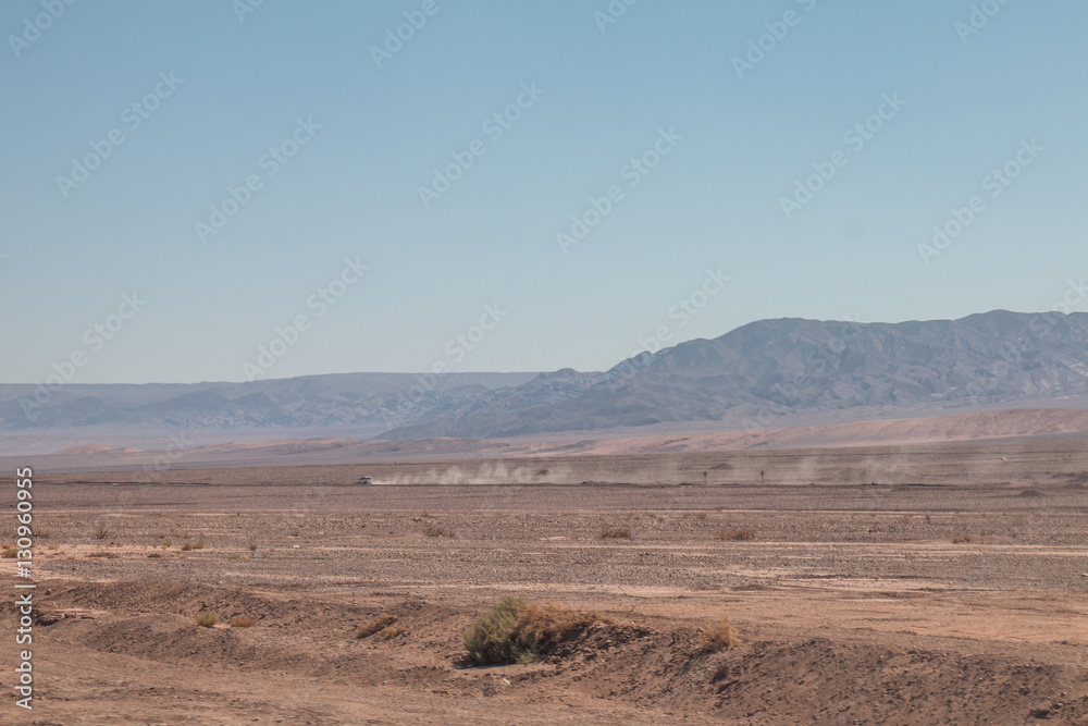 Off-road vehicle driving through Atacama Desert, Chile.