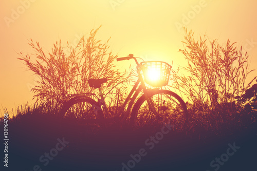 vintage bike with beautiful landscape image on sunset.