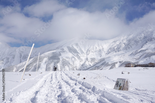 Mudoro field in November with snow mountain background photo