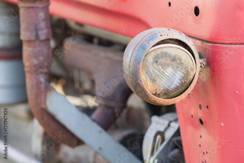 Old tractor face, selective focus on it's light