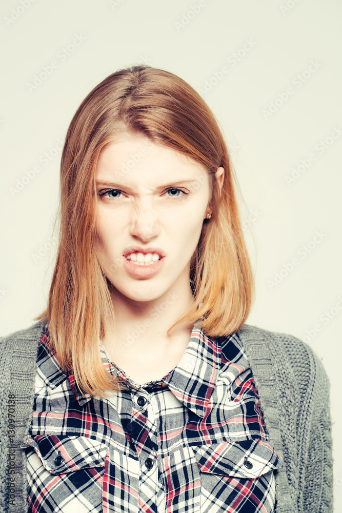 Dissatisfied girl wrinkles nose Dissatisfied girl wrinkles nose