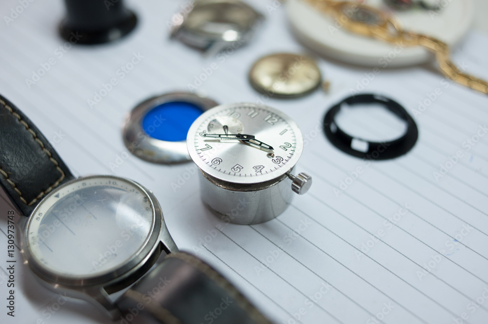Detail of watch machinery on the table. Detail of watch machinery on the table.