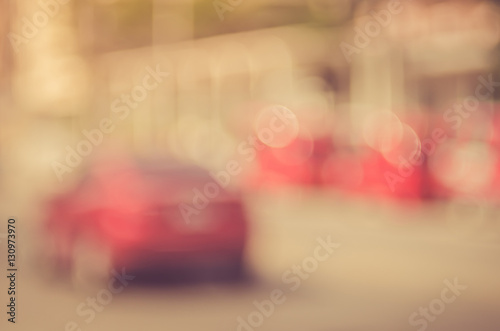 Blur traffic road with old building abstract background.