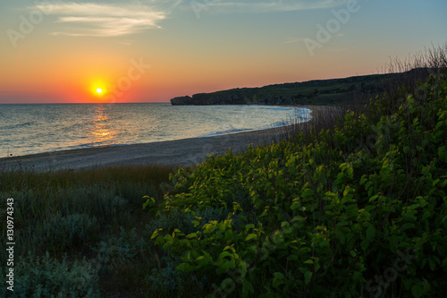 Sun rises over the Sea of Azov on Generals beach. Karalar regional landscape park in Crimea.