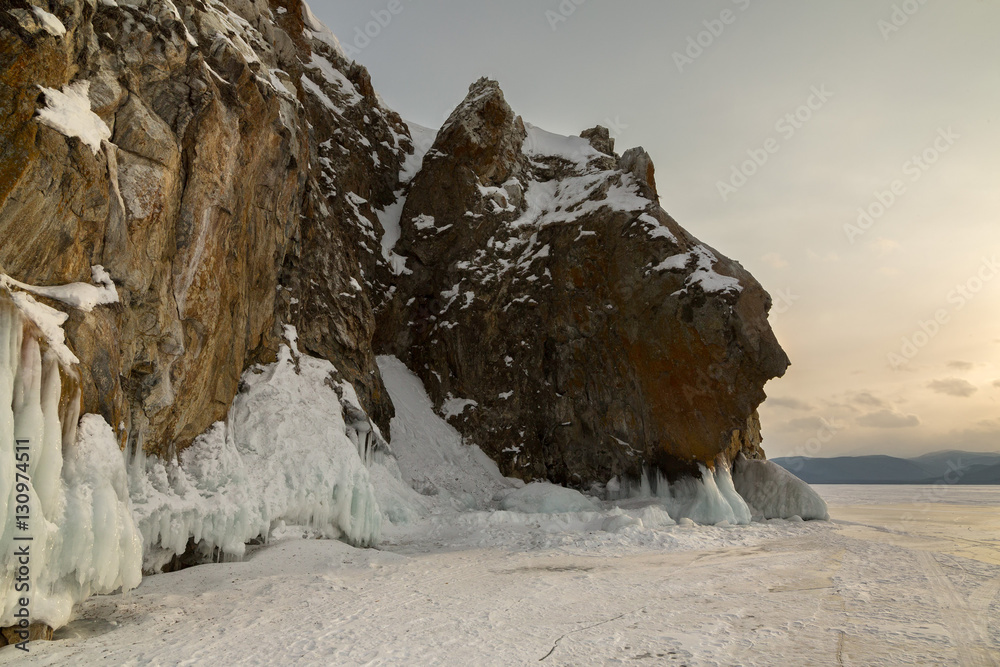 Beautiful icicles on rocks. Winter landscape in Lake Baikal.
