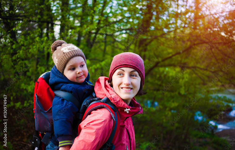 The mother and son are traveling. The mother and son are traveling.