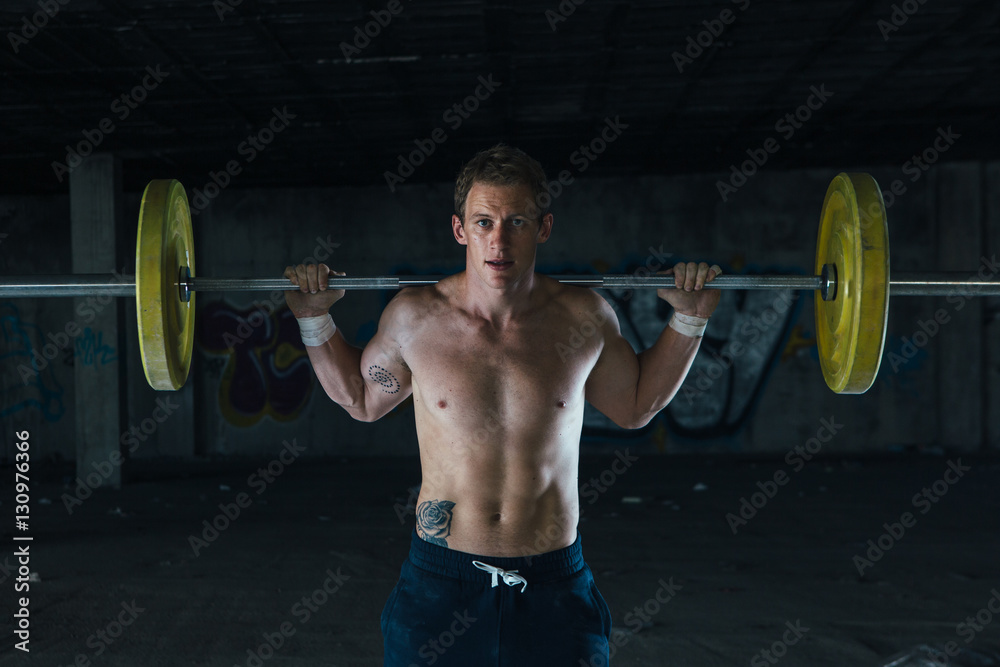 Man working out in abandoned building Man working out in abandoned building